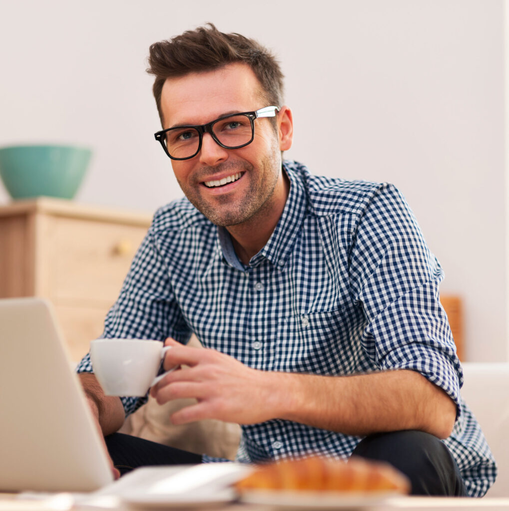 storyblocks-portrait-of-smiling-man-working-at-home_Bb-G3T6D9f